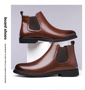 Detailed side view of classic brown leather Chelsea boots for men with elastic side panels