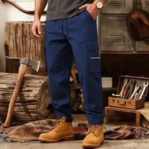 Men's loose tactical cargo pants with multi-pockets in deep blue, styled in a workshop.