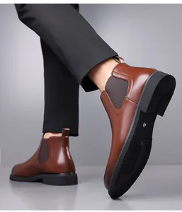 Close-up of brown leather Chelsea boots for men with walking pose and sole detail