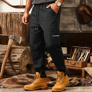 Men's loose black tactical cargo sweatpants with functional multi-pocket detailing.