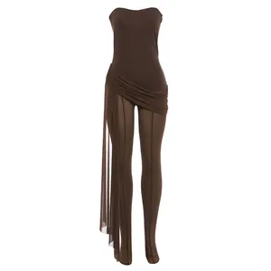 Detail of brown strapless jumpsuit featuring sheer mesh legs and wrap waist detail.