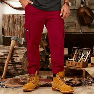 Men's loose burgundy tactical cargo pants with multi-pockets in outdoor workshop setting
