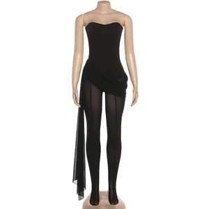 Front view of sexy black bandeau jumpsuit with sheer mesh legs and side drape detail