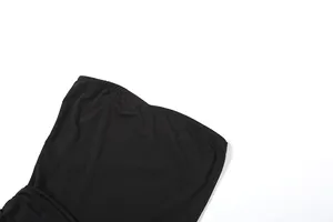 Detailed close-up view showing the elastic neckline of this black slim jumpsuit