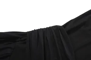 Close-up detail of black mesh splicing and fabric texture on a slim sexy jumpsuit