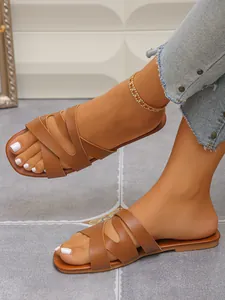 Chic brown cross-strap flat sandals for women, casual summer style on-foot detail