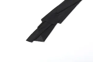 Close-up detail of sexy black semi-transparent mesh fabric for women's jumpsuit