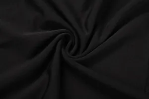 Detailed macro shot showcasing the soft texture of premium black mesh fabric for women's jumpsuit