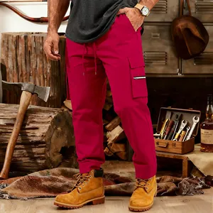 Outdoor detail of men's red multi-pocket tactical cargo sweatpants with drawstring waist