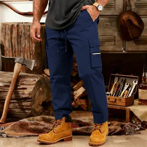 Detail view of men's navy blue tactical cargo pants with multi-pockets and drawstring waist