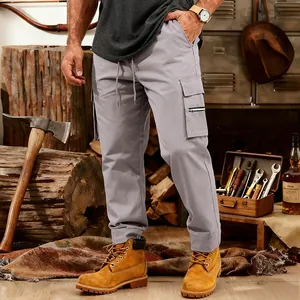 Close-up detail of men's loose light grey tactical cargo sweatpants with multi-pockets