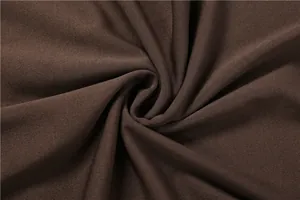 Close-up detail showing the high-quality brown breathable fabric texture of the jumpsuit.