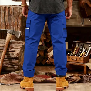 Back view of men's loose blue tactical cargo pants in a rustic workshop setting.