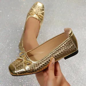 Elegant French style metallic gold woven flat ballet shoes featuring delicate bow detail