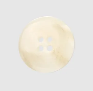 Macro detail view of a premium cream-colored resin button with four holes for clothing.