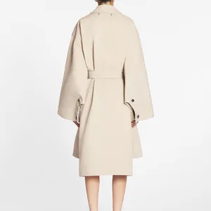 Beige oversized trench coat featuring high-end urea buttons on sleeves back view