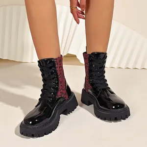 Stylish leopard print platform combat boots for women featuring black patent leather finish