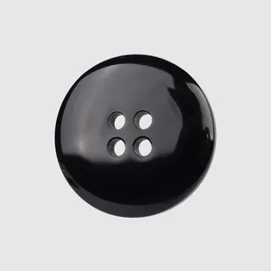 High-end black resin button with 4-hole design for professional garment tailoring.