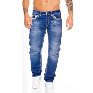 Detail shot of men's slim fit blue jeans with white double-stitching details.