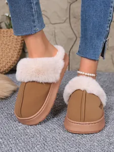 Close-up of warm winter slippers with cozy faux fur trim and durable platform sole