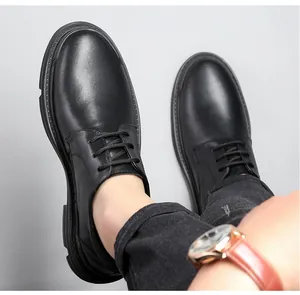 Detailed view of men's black leather casual shoes with soft soles and lace-up design