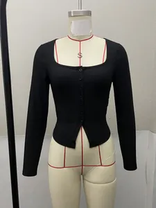 Detail of a black square-neck ribbed knit top with button front on a mannequin