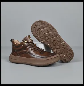 Detail view of premium brown leather high-top sneaker and non-slip sole pattern