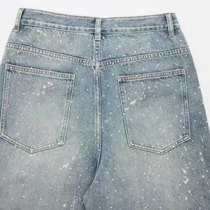 American style light wash denim jeans with paint splatter and rhinestone details