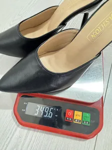 Detailed weight measurement for elegant black pointed-toe stiletto mules at 349.6g