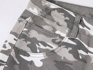 Close-up detail of grey camouflage denim cargo pants featuring pocket and waist design