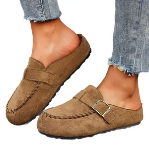 Comfortable brown suede closed-toe mule shoes with metal buckle strap and stitch detail