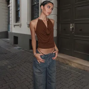 Brown halter top featuring a stylish metal collar and elegant draped cowl neck design