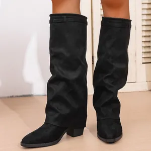 Stylish black suede pointed-toe slouchy boots with chunky heels and pant-leg design.