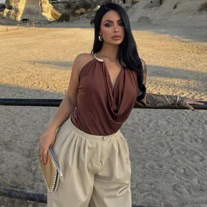 Elegant brown cowl neck halter vest featuring metallic neck detail and a backless design