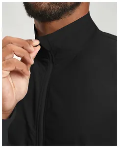 Detail showing the durable zipper and stand collar of a black men's athletic jacket