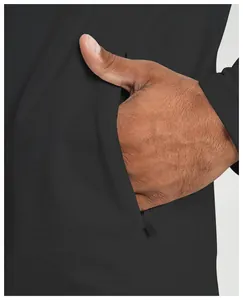 Close-up detail of zipper pocket on men's black athletic long sleeve sports jacket.