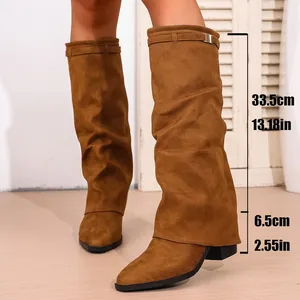 Detailed view of brown slouchy high-tube boots with height and heel measurements.