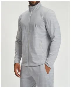 Detailed macro view of men's grey color-blocked athletic jacket with a functional zip pocket