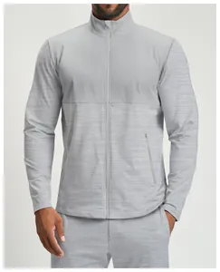 Close-up of men's athletic zip-up jacket featuring contrast color paneling details
