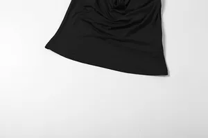 Detailed close-up of the hem and soft fabric texture of a sexy black cowl neck halter tank top