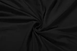 Detailed close-up view of soft black knitted fabric texture with elegant draping folds