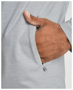 Close-up of side zipper pocket on men's gray athletic performance jacket