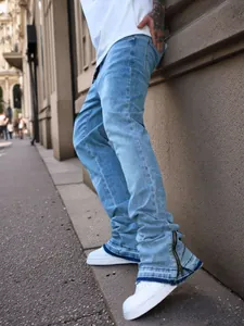 Light blue loose micro-flare jeans with zipper hem and whiskered details for men
