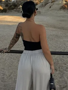 Sexy black halter backless vest with metal chain detail for a chic Western fashion look