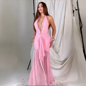 Full-length view of a sexy pink halter neck dress with ruffled neckline and mesh skirt