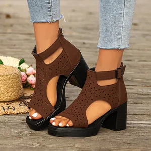 Brown block heel peep toe sandals with laser-cut flower patterns and platform sole.