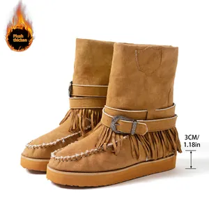 Detail of tan fringe snow boots with buckle strap and 3cm platform sole