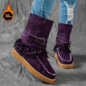 Detailed view of women's purple suede fringe snow boots with thick plush warm lining