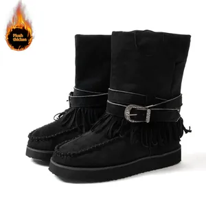 Detailed view of black women's fringe snow boots with plush lining and buckle strap.