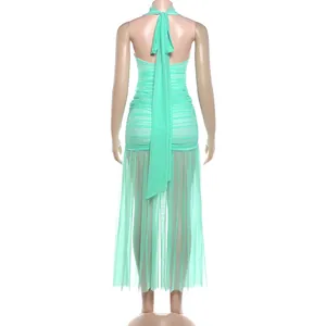 Detailed back view of mint green halter ruched dress with elegant sheer mesh splicing